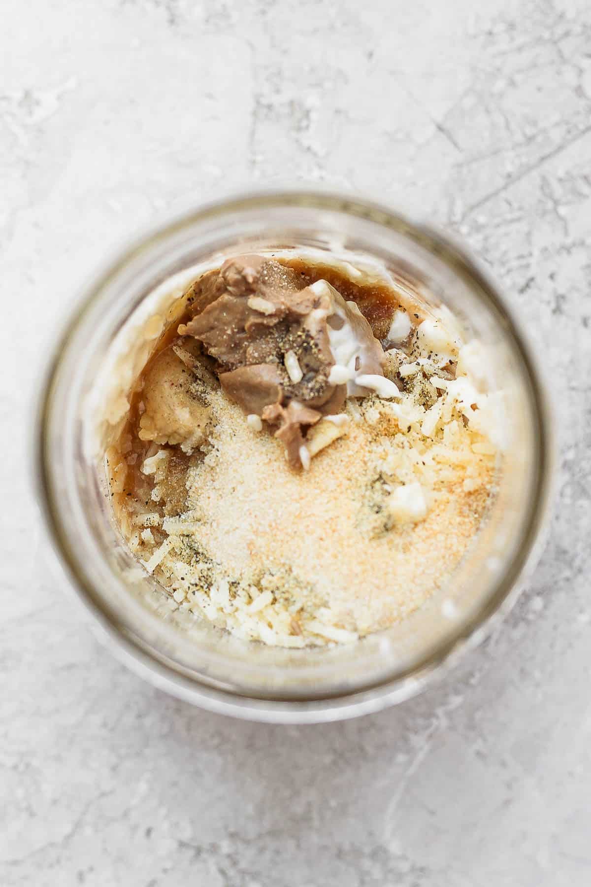 Healthy caesar dressing ingredients in a mason jar.