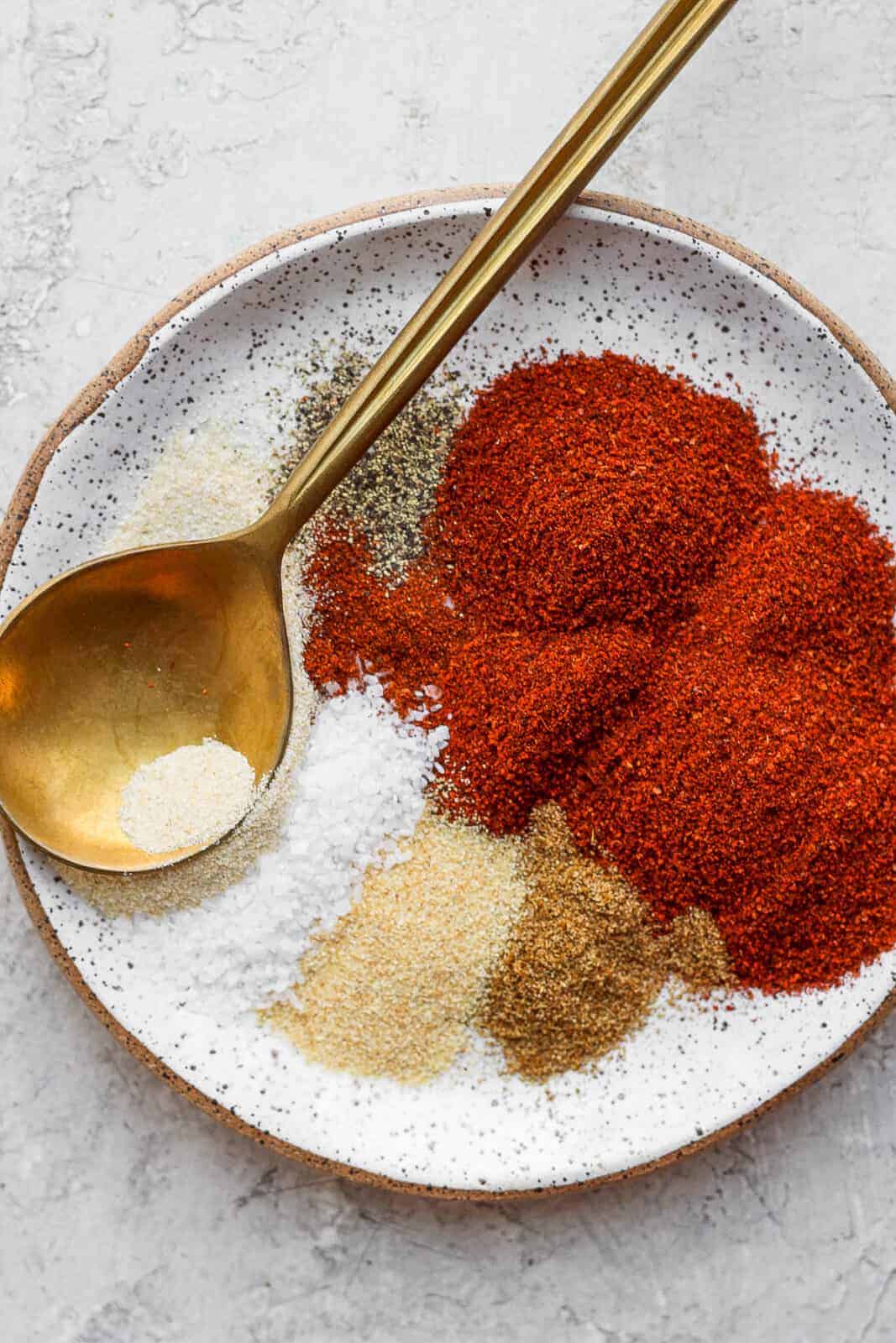 Chili seasoning ingredients on a plate.