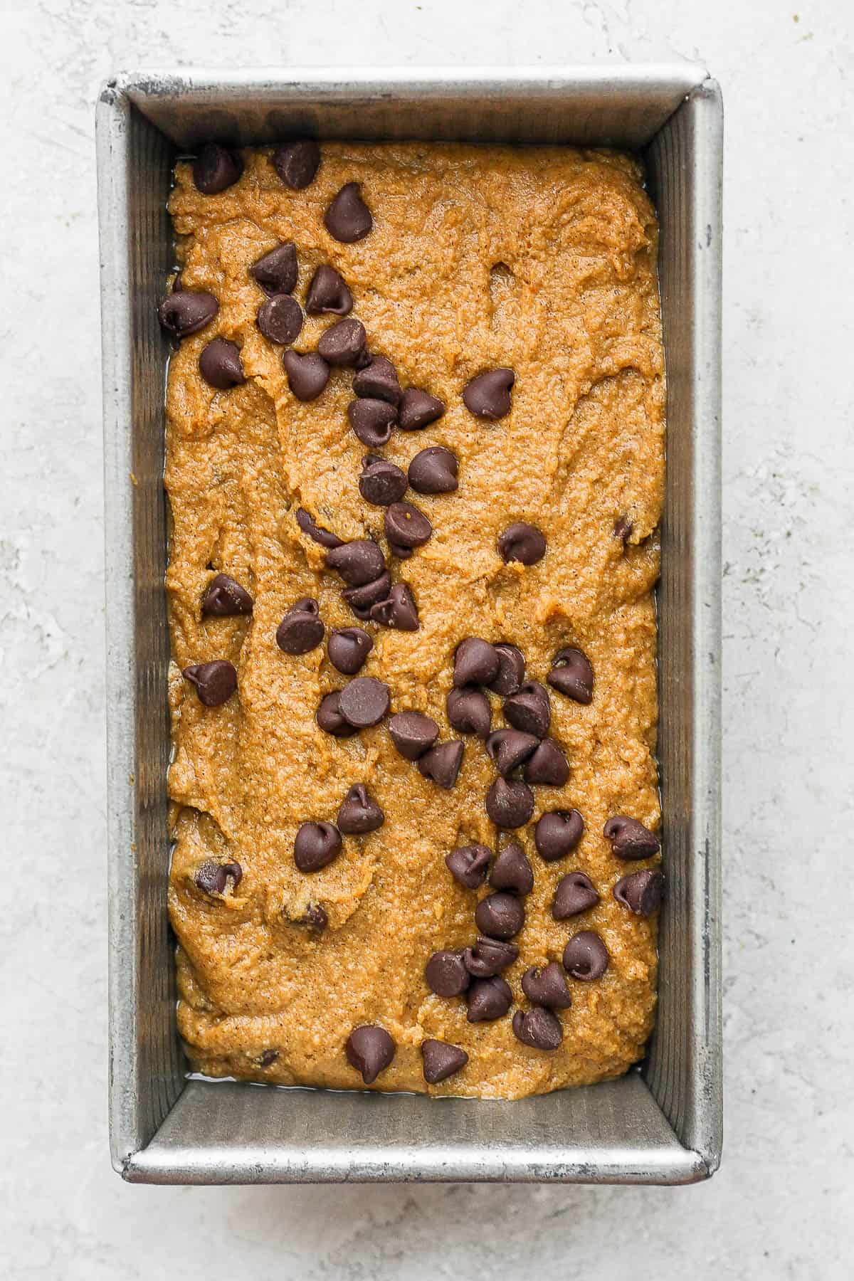 Pumpkin bread batter in a baking pan.