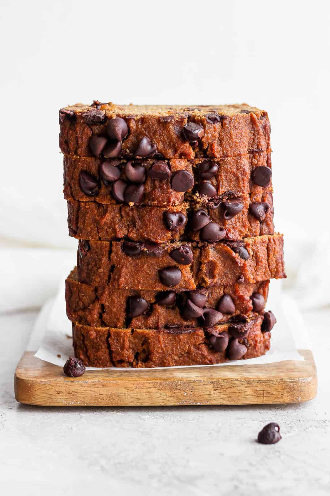 Sliced pumpkin bread stacked in a pile.