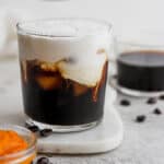 Glass of pumpkin cream cold brew latte.