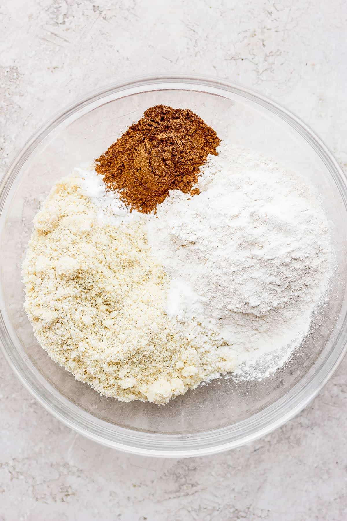 Dry ingredients for pumpkin bread in a mixing bowl.