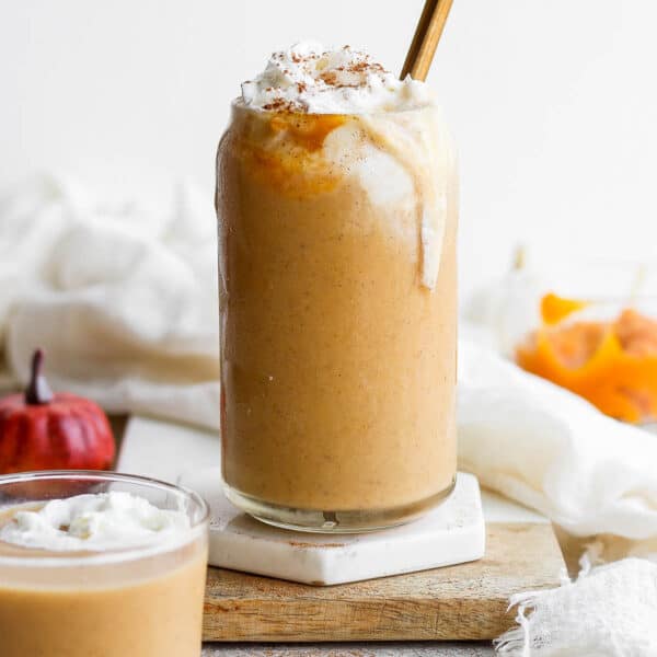 Glass full of pumpkin smoothie.