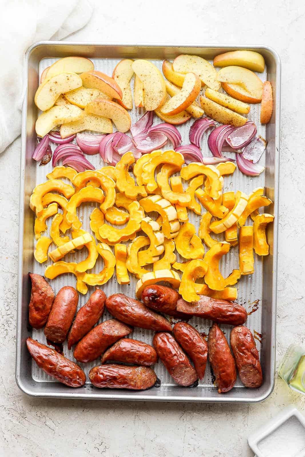 The sheet pan with all ingredients on it.
