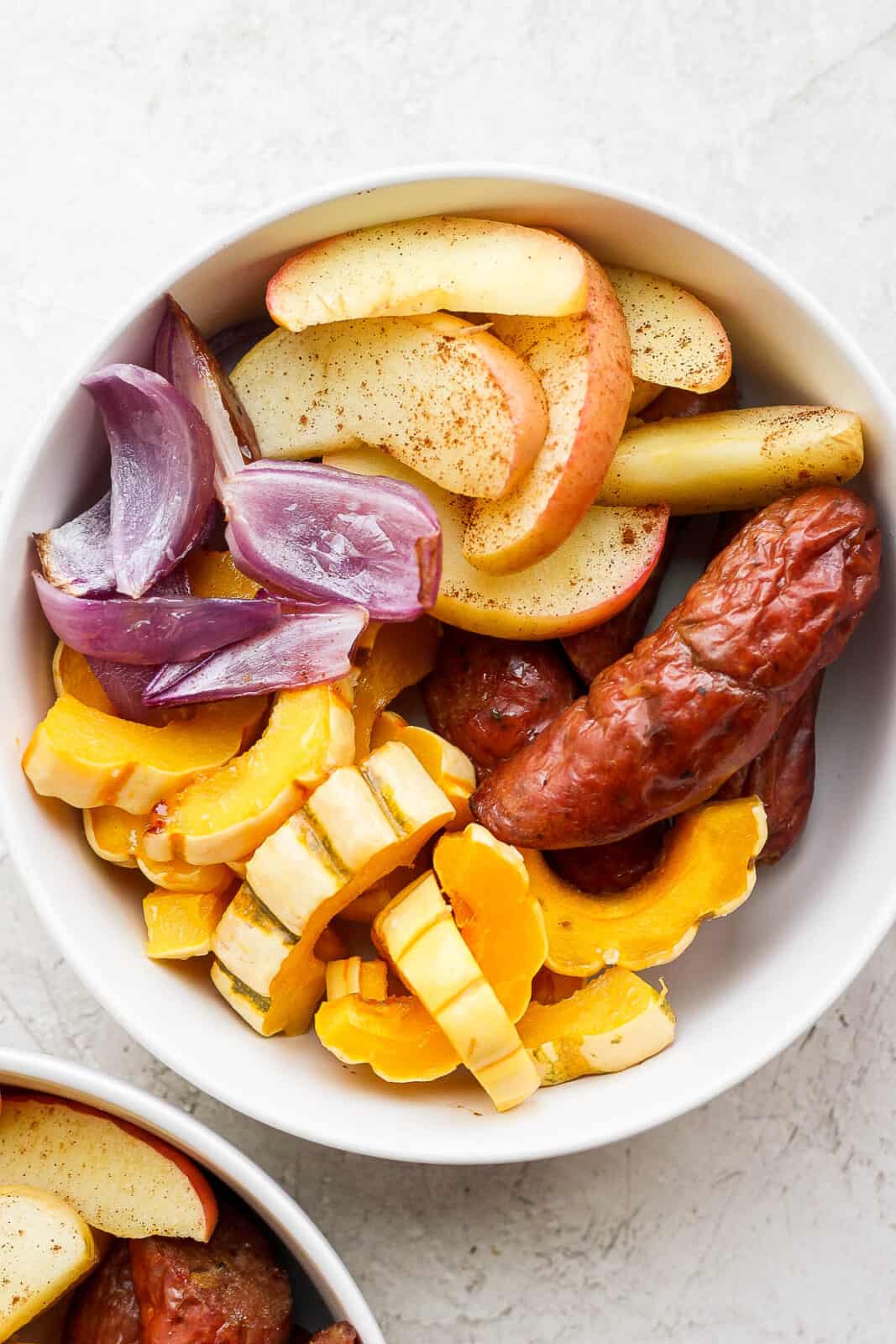 The sausage sheet pan meal in a bowl.