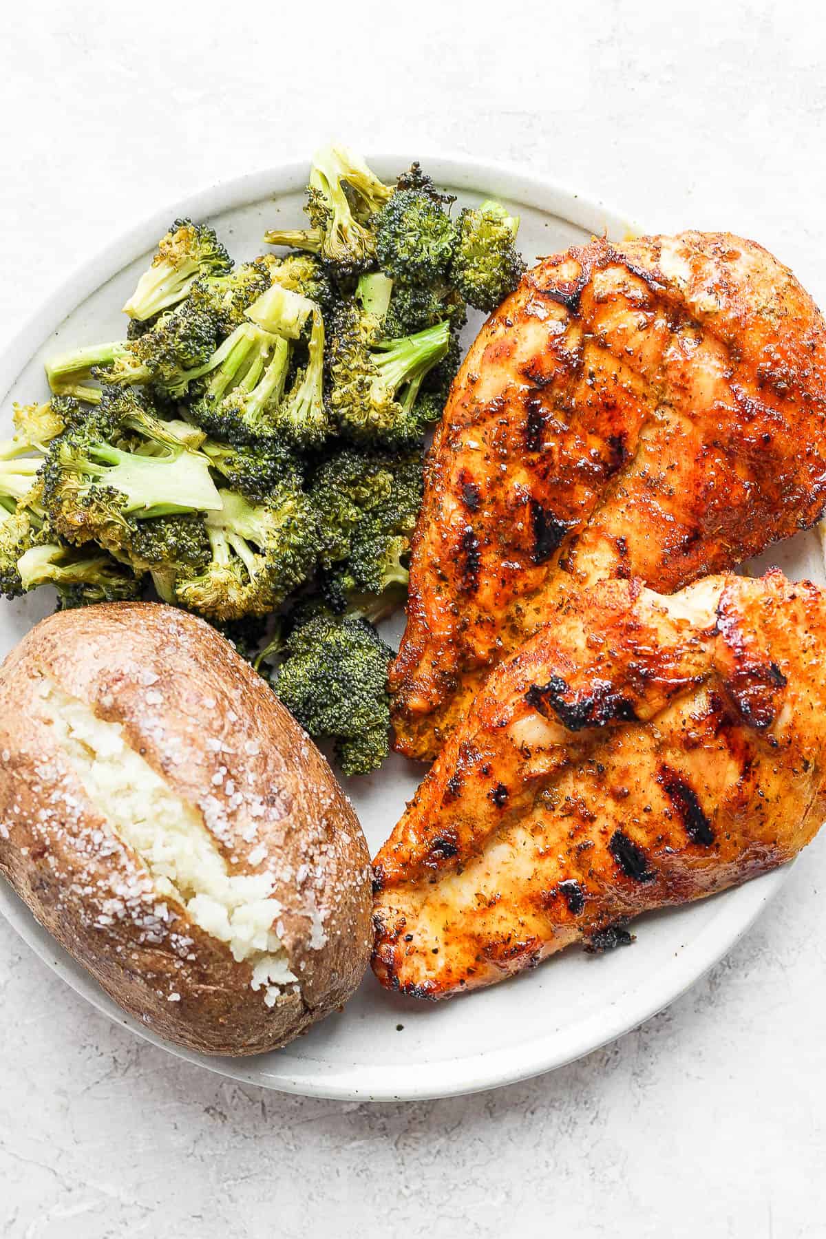 Plate of chicken breast, broccoli and potato. 