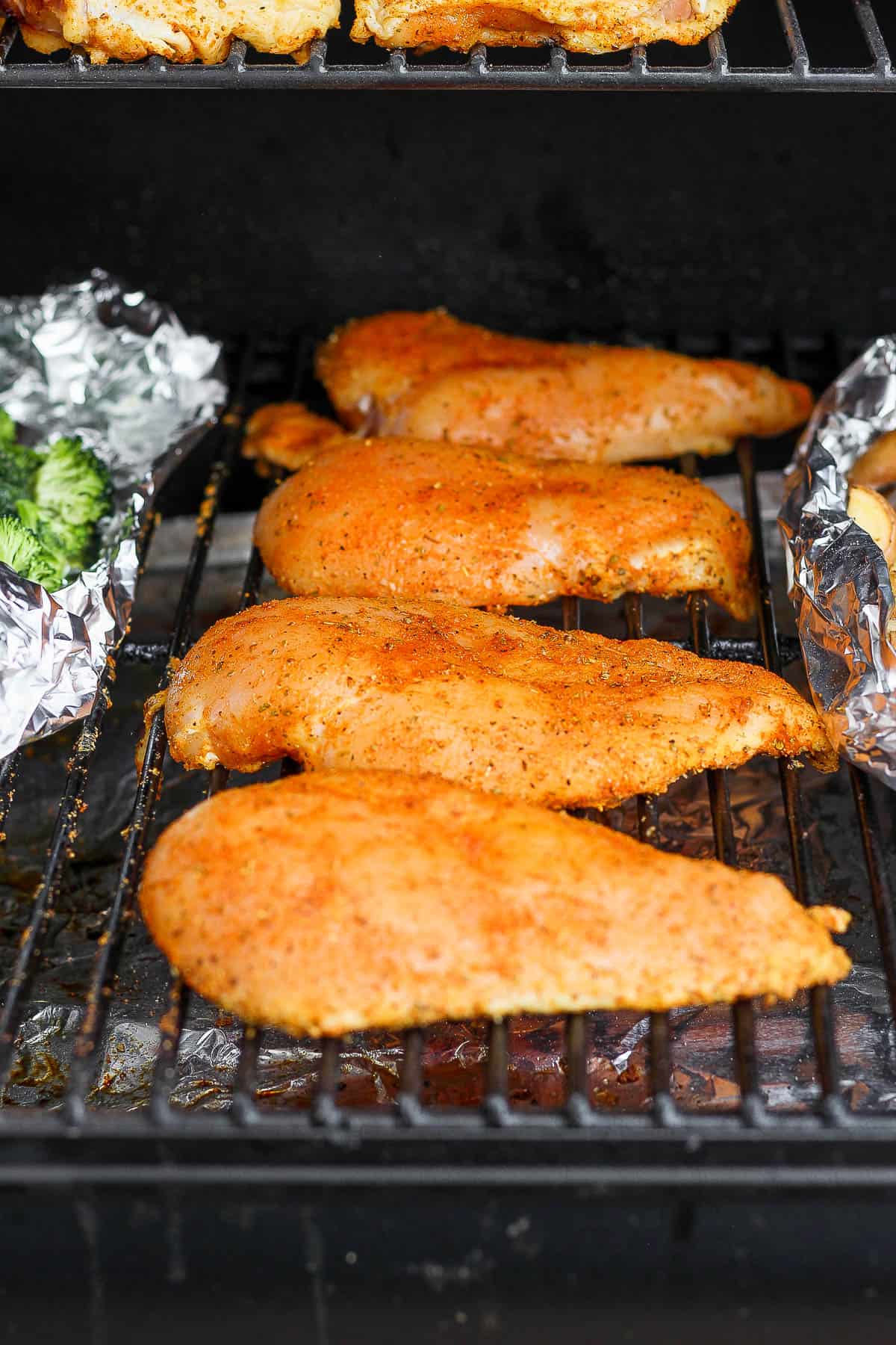 Chicken breasts on a smoker.