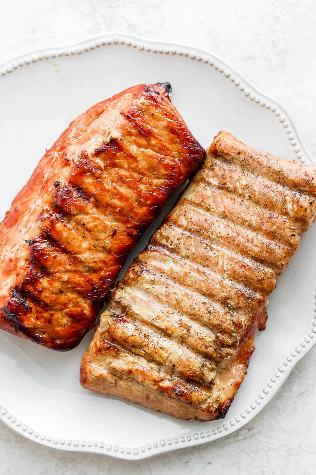 Two smoked pork loins on a plate. 