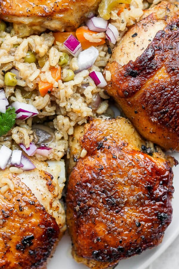 A plate of baked chicken and rice.