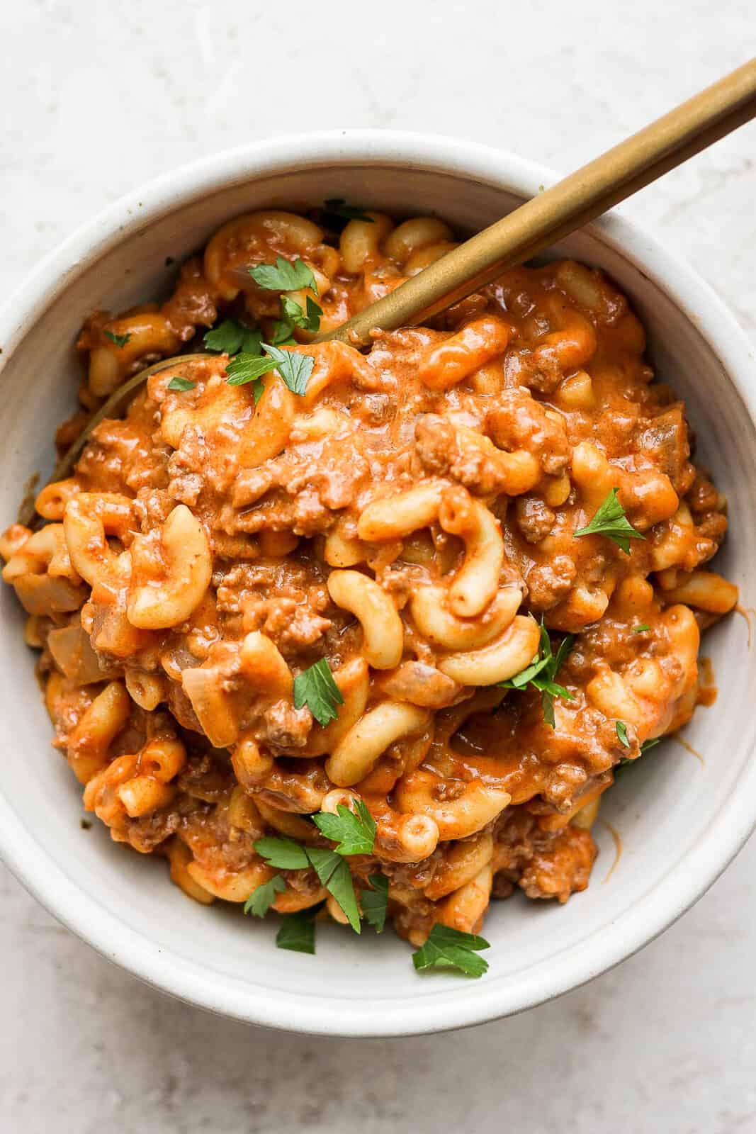 Healthy Hamburger Helper in a bowl with a spoon.