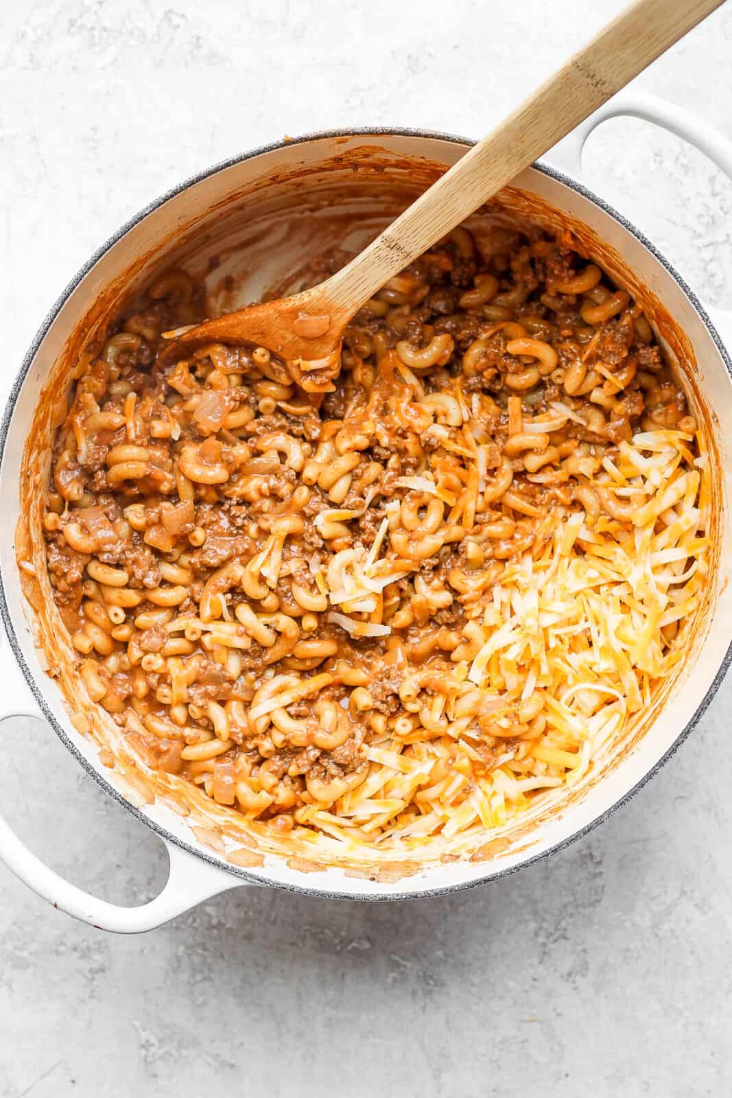 Cheese added to the pot of hamburger helper.