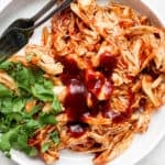 Bowl of instant pot bbq chicken with cilantro.