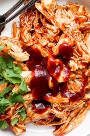 Bowl of instant pot bbq chicken with cilantro.