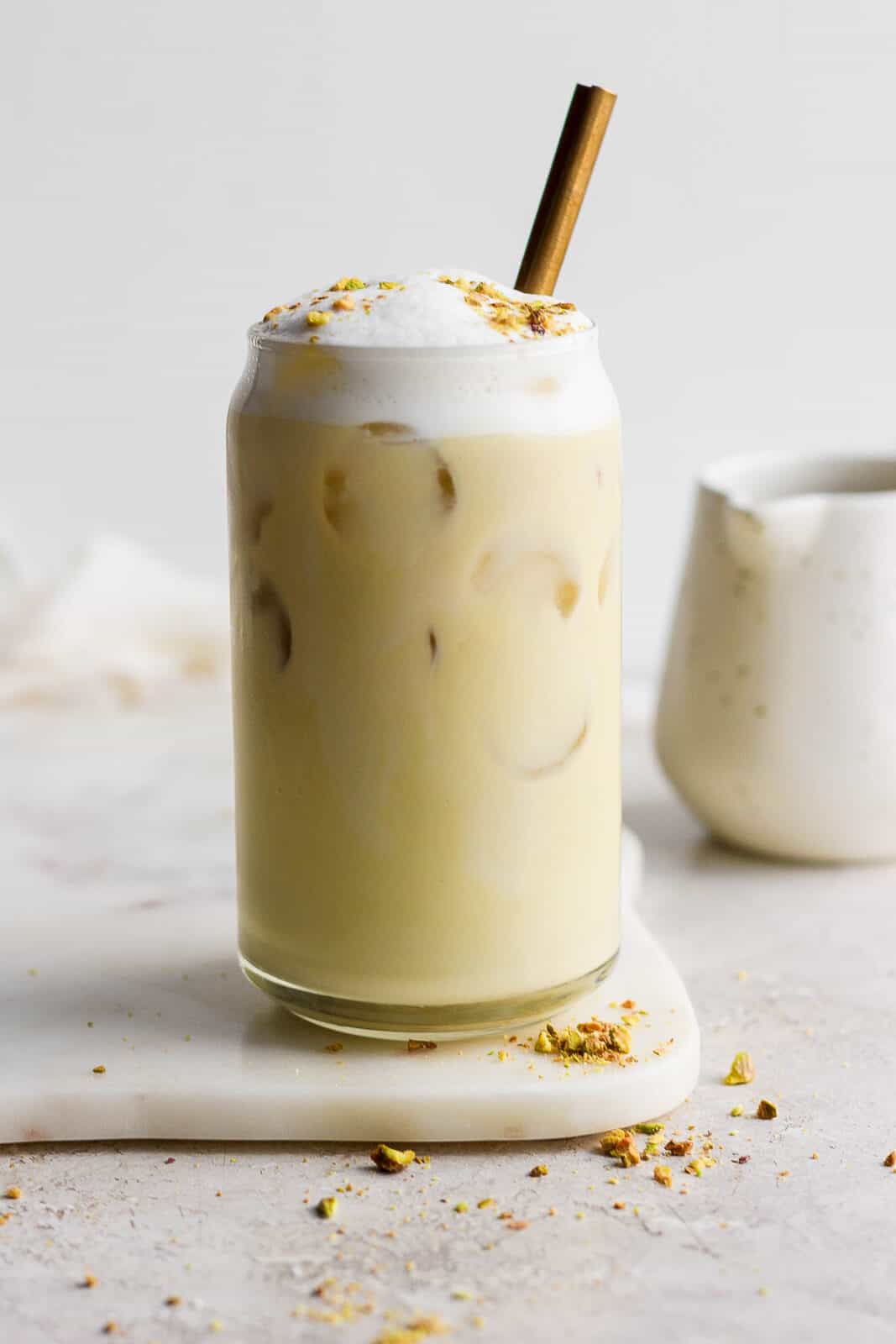 Iced pistachio latte in a glass.