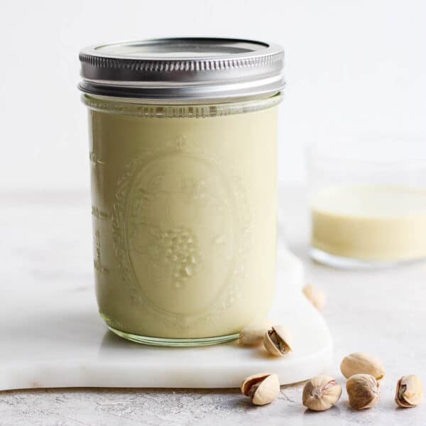 Mason jar full of pistachio milk.