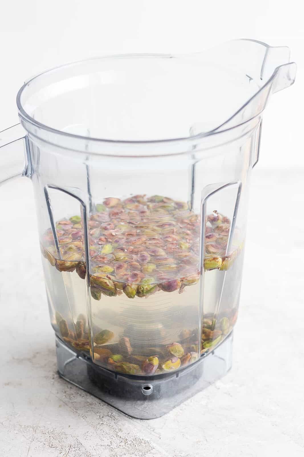 Pistachios in a blender with water.