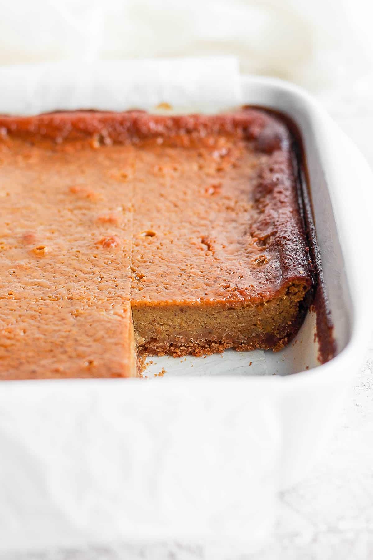 Pumpkin pie bars with one taken out of the pan.