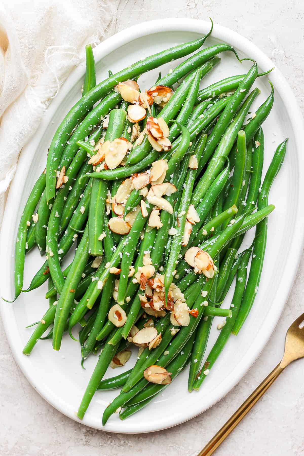 Green bean almondine on a plate.