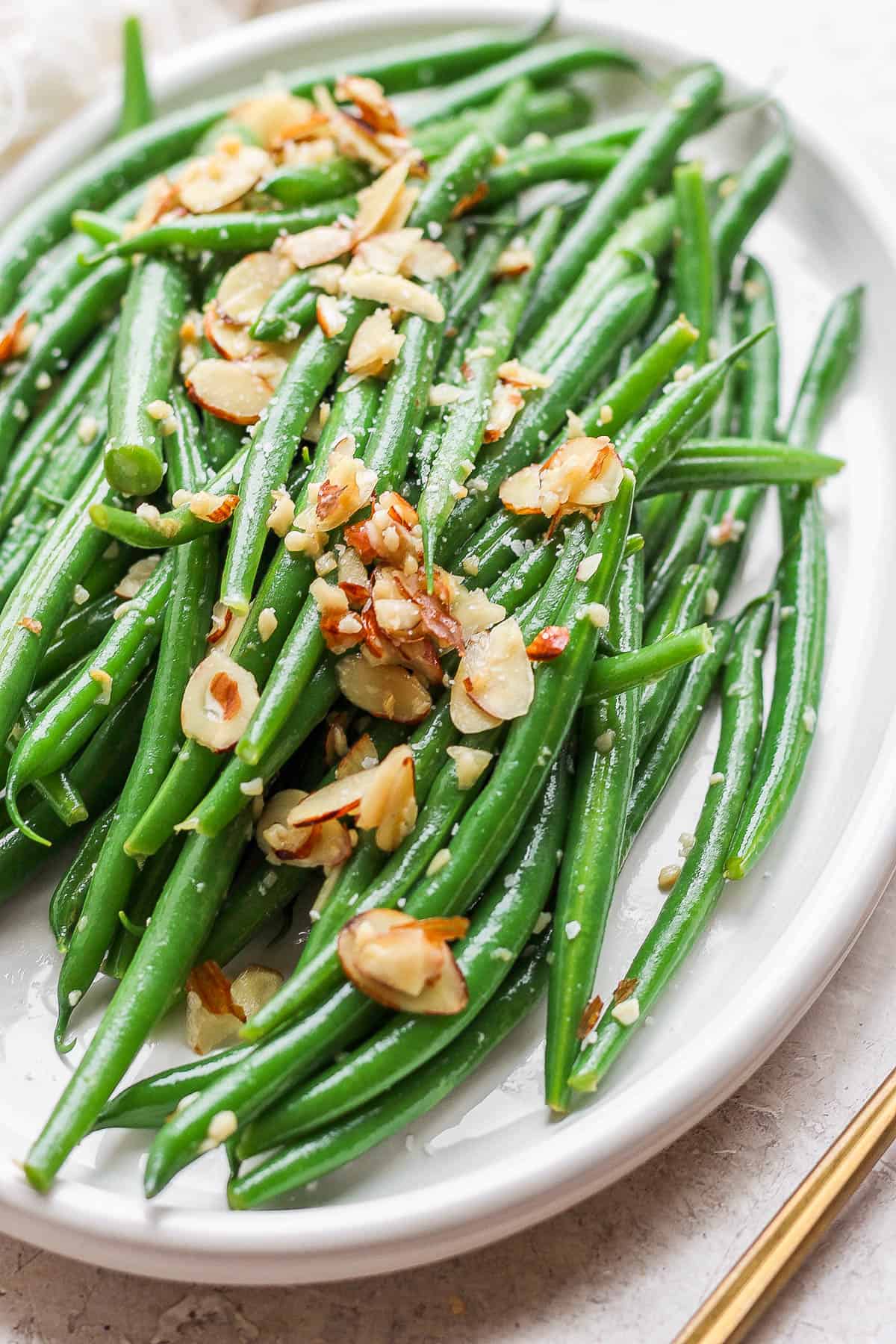 Green bean almondine on a plate.