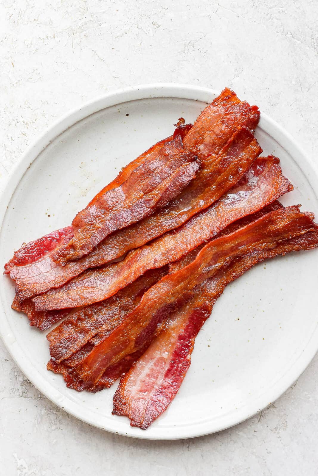 A plate of bacon after baking in the oven.
