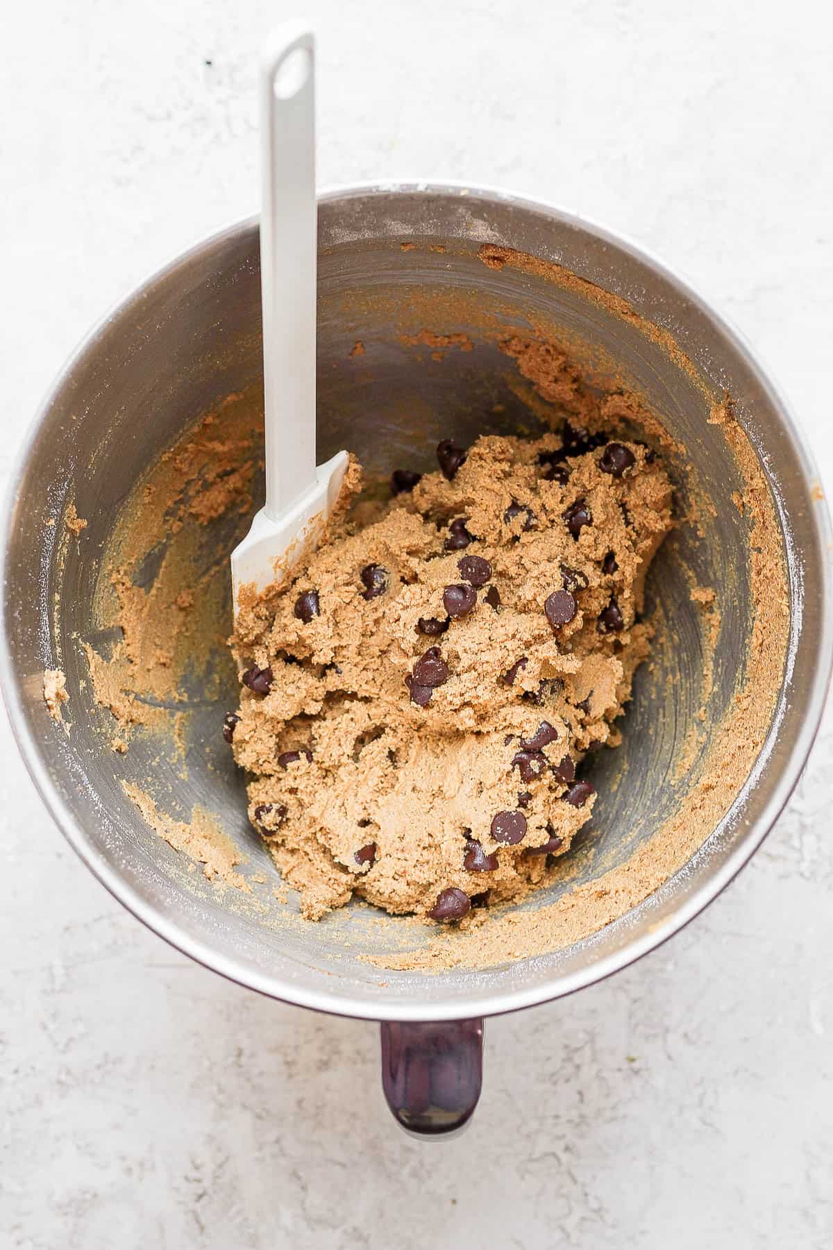 Paleo chocolate chip cookie dough with a spatula.