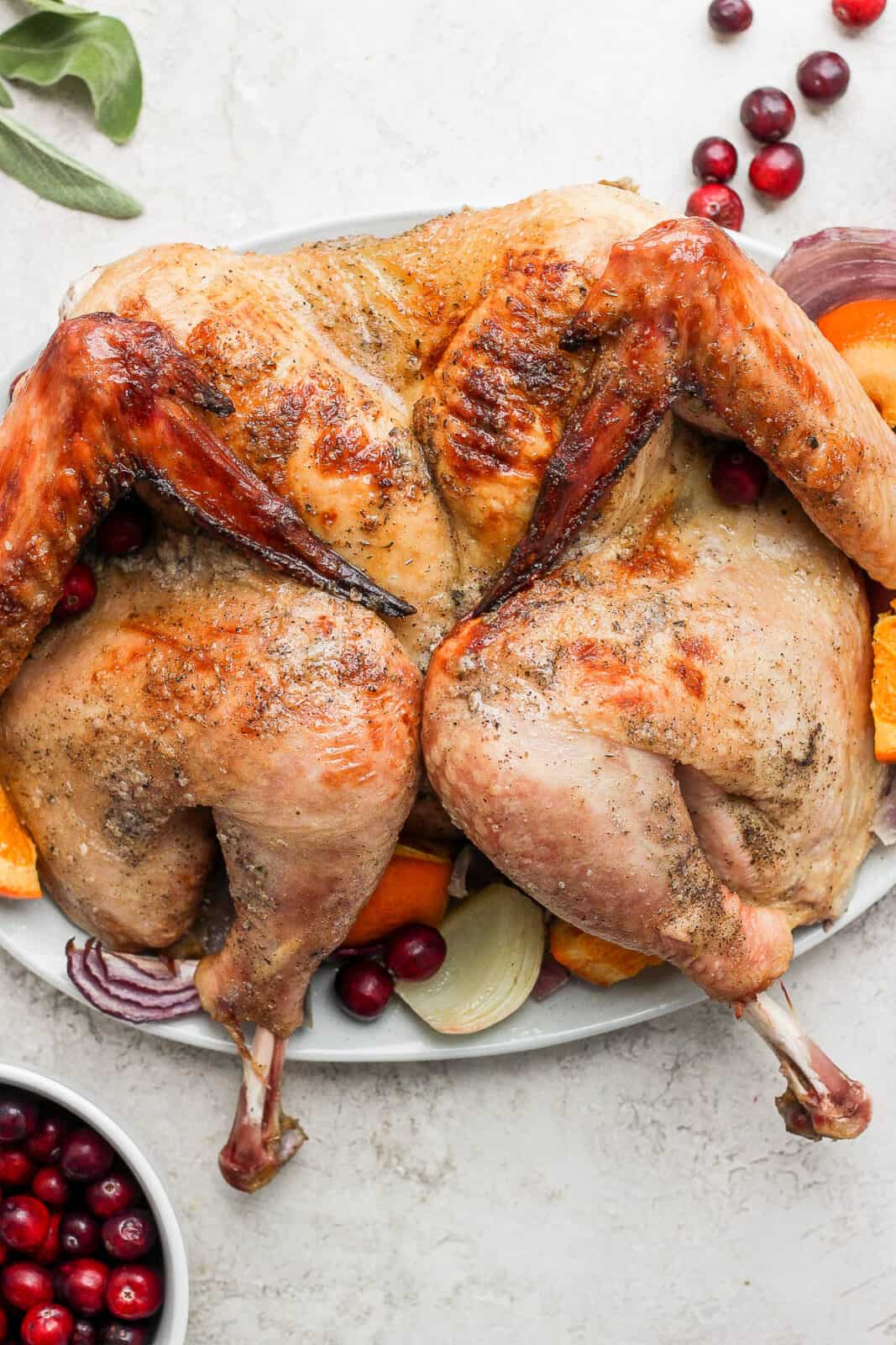 A spatchcocked turkey on a platter.