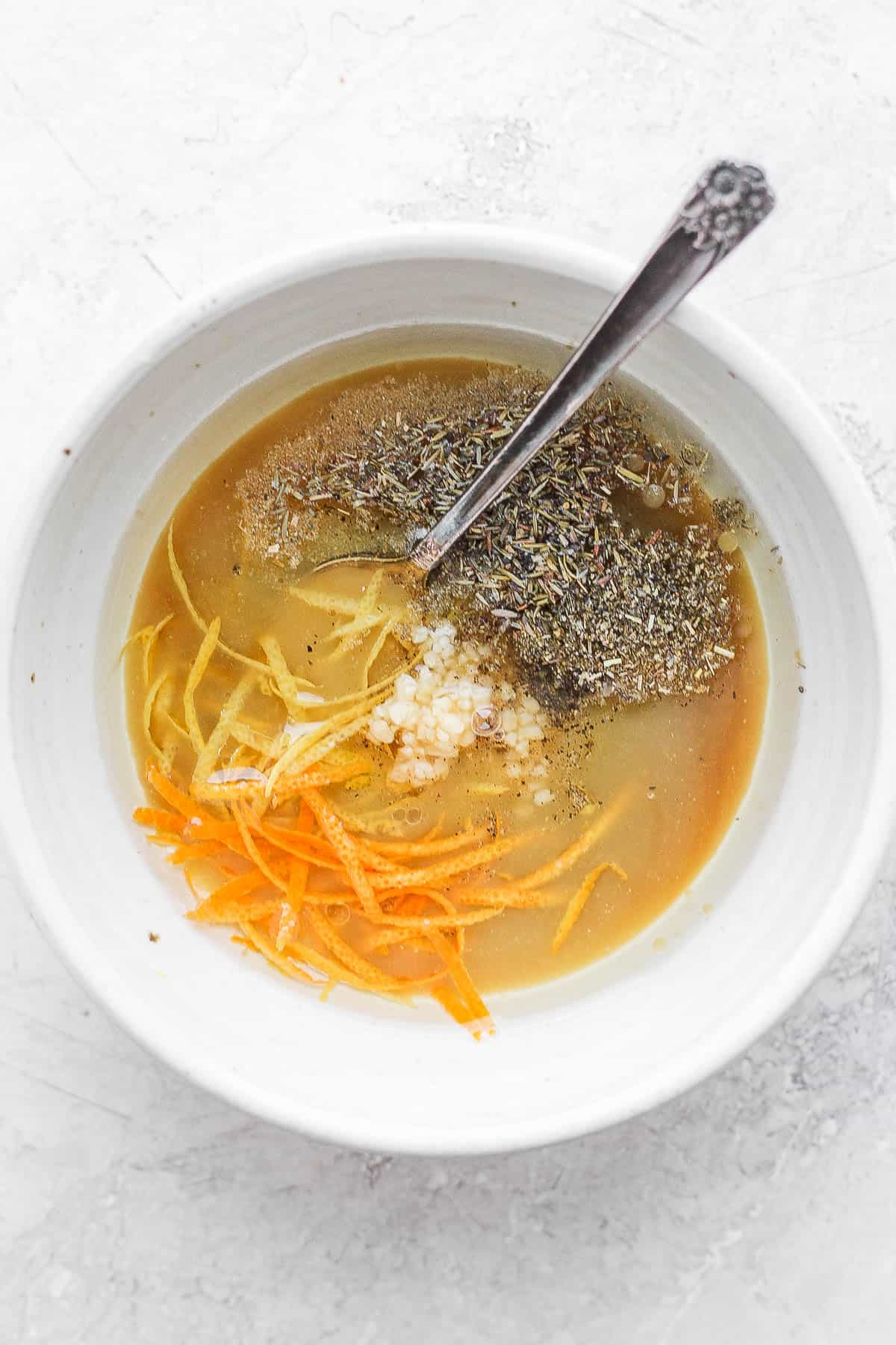 A bowl with the turkey marinade ingredients before mixing.