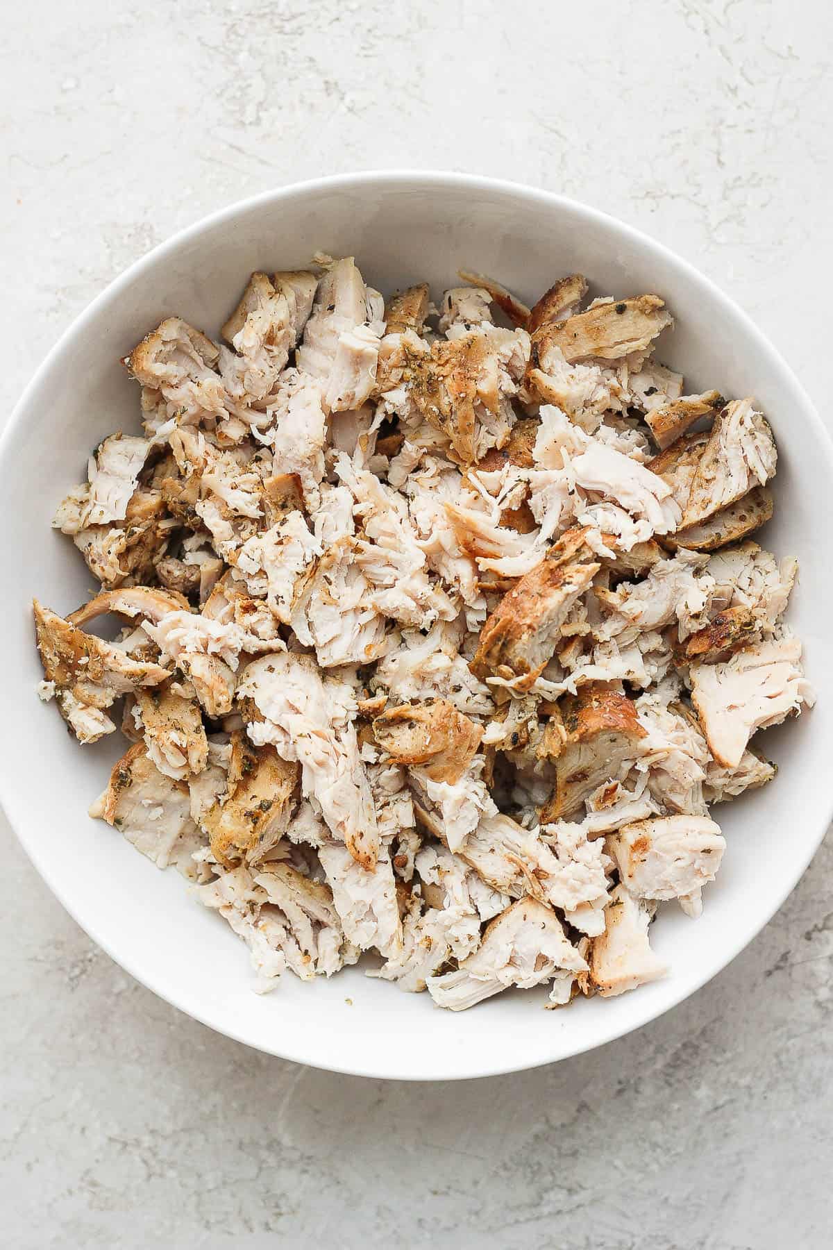 A bowl of shredded turkey.