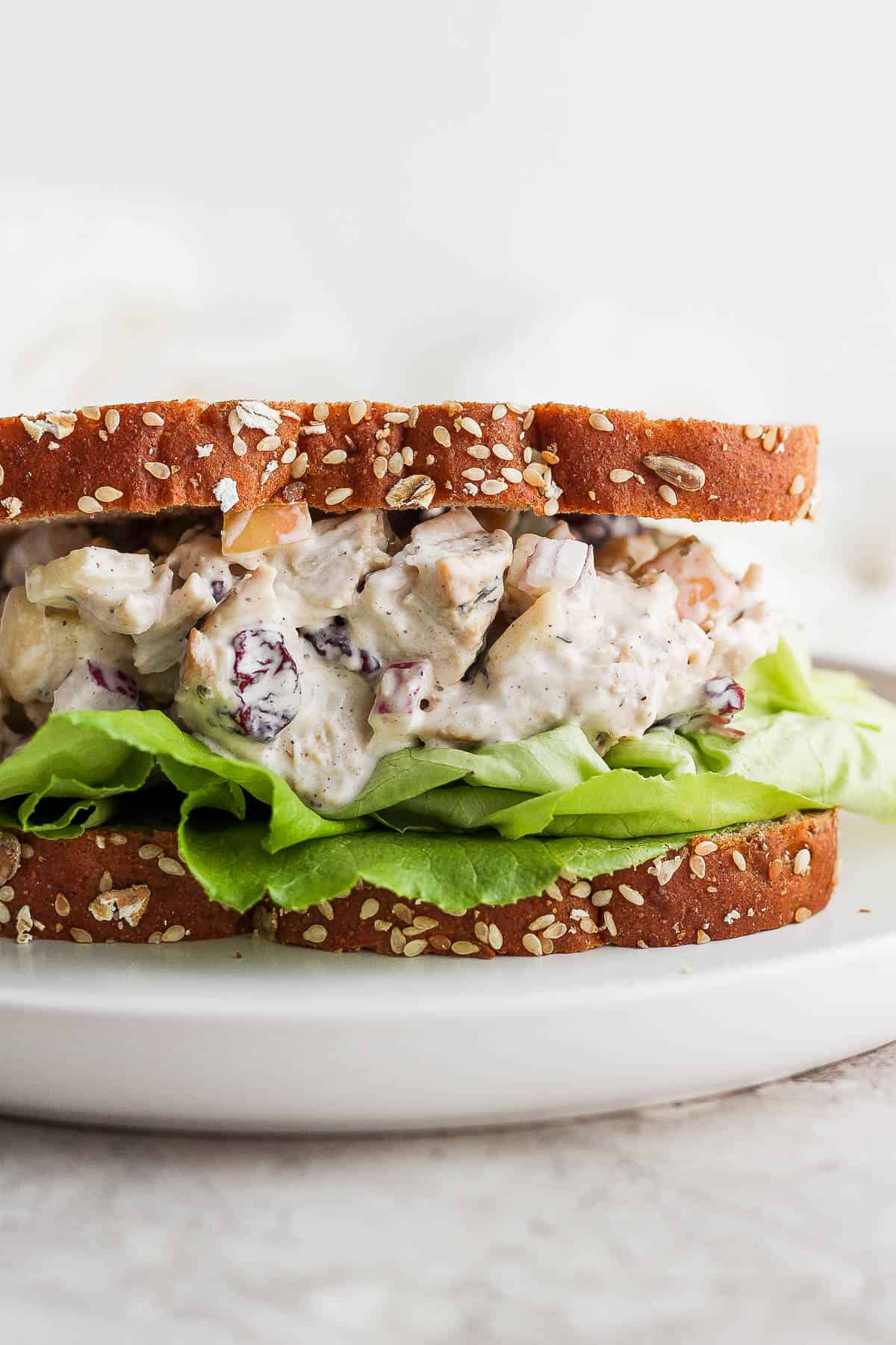Turkey salad as a sandwich with some lettuce.