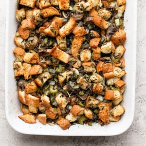 Wild rice stuffing in a white baking dish.