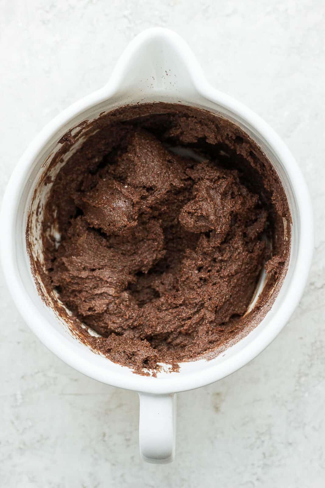 Batter for almond flour brownies in a bowl. 