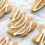 An almond flour sugar cookie cut into a Christmas tree.