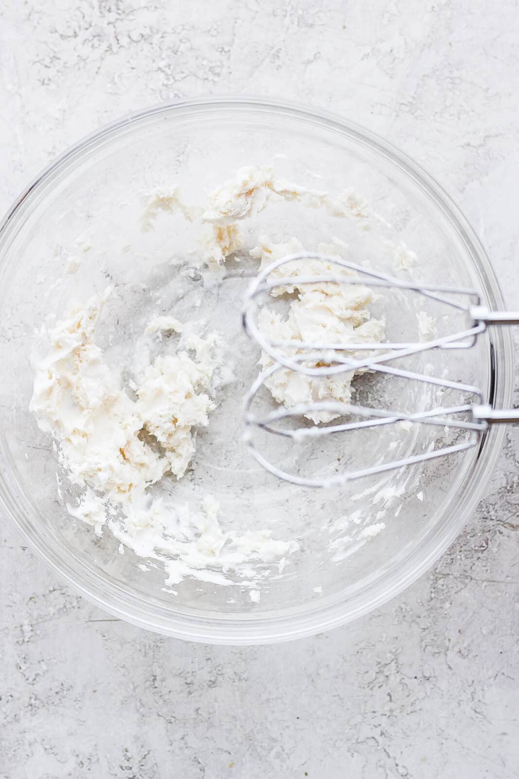 Plant butter and vanilla extract mixed together with a hand mixer.