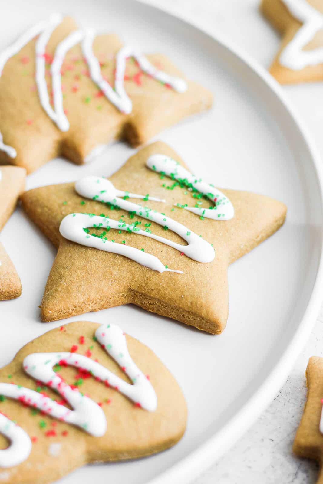 Decorated cut-out cookies on a plate.