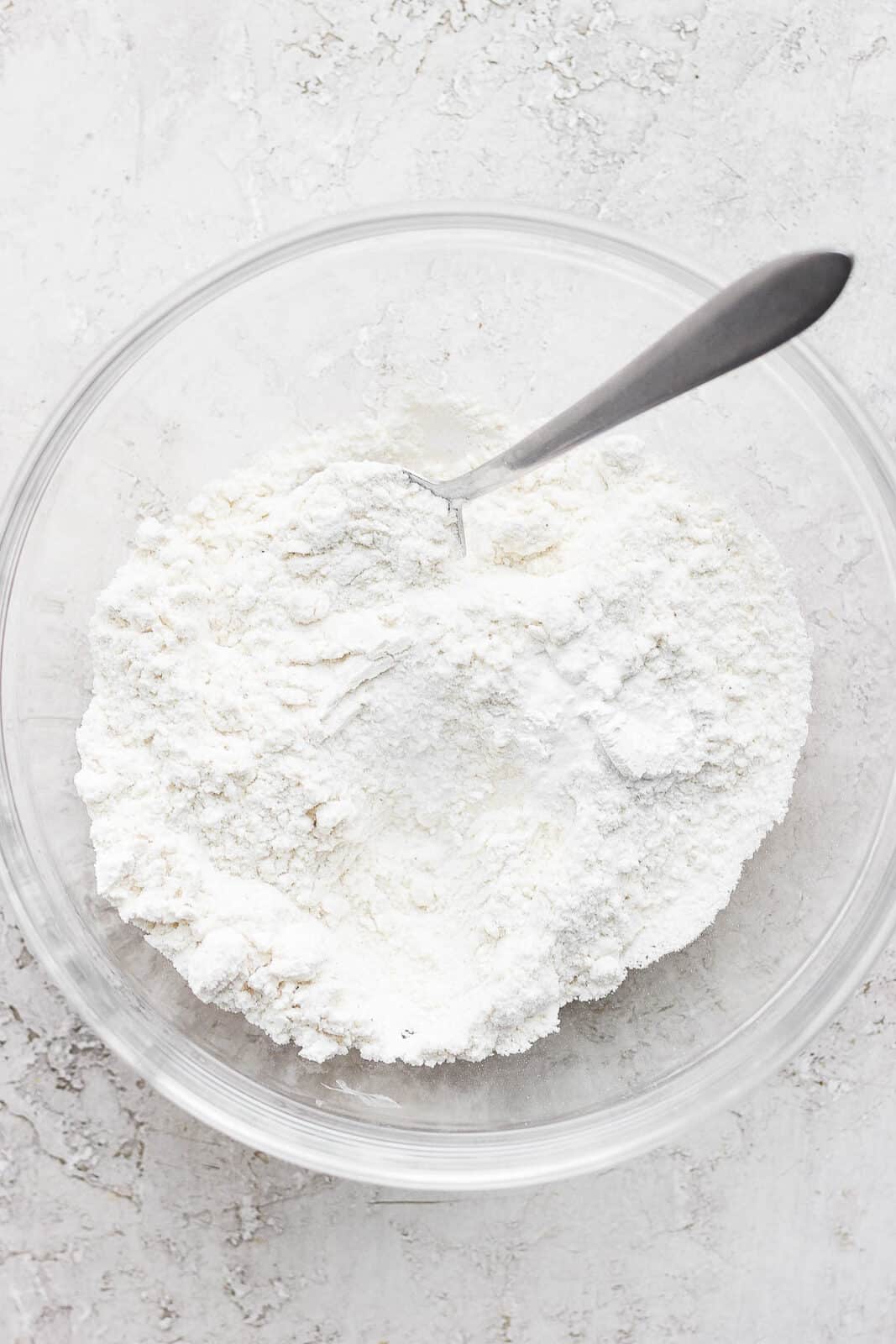 Dry ingredients for gluten free sugar cookies mixed together in a bowl.