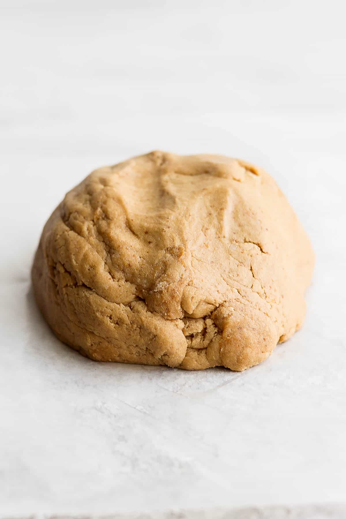 Gluten free sugar cookie dough rolled into a ball.