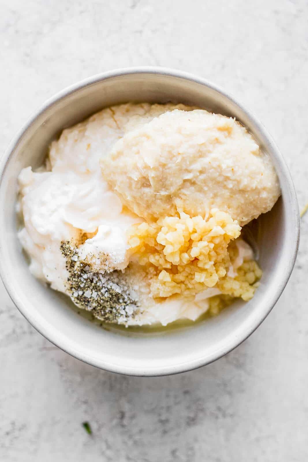 A bowl of ingredients for horseradish sauce for prime rib. 