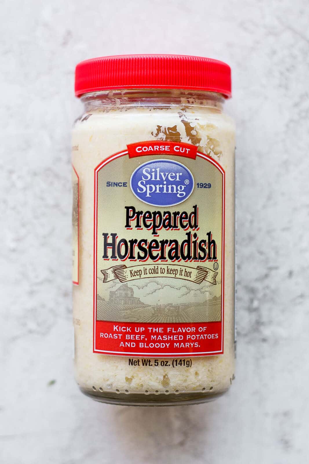 A jar of prepared horseradish.