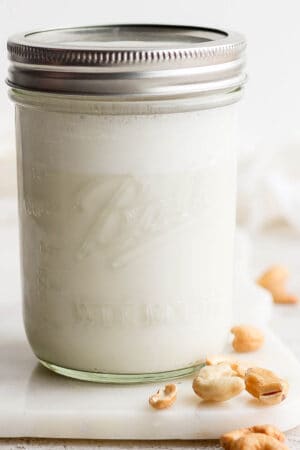 Mason jar of homemade cashew milk.