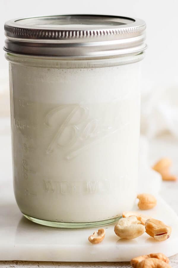 Mason jar of homemade cashew milk.
