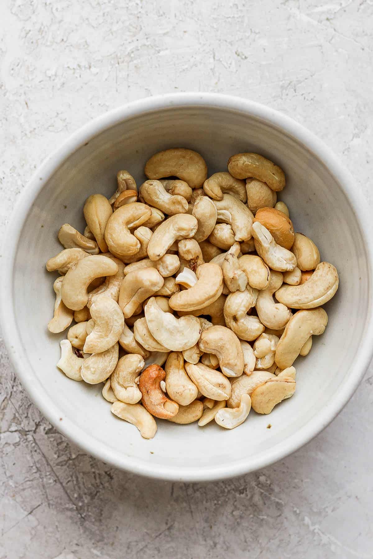 Raw cashews in a bowl.