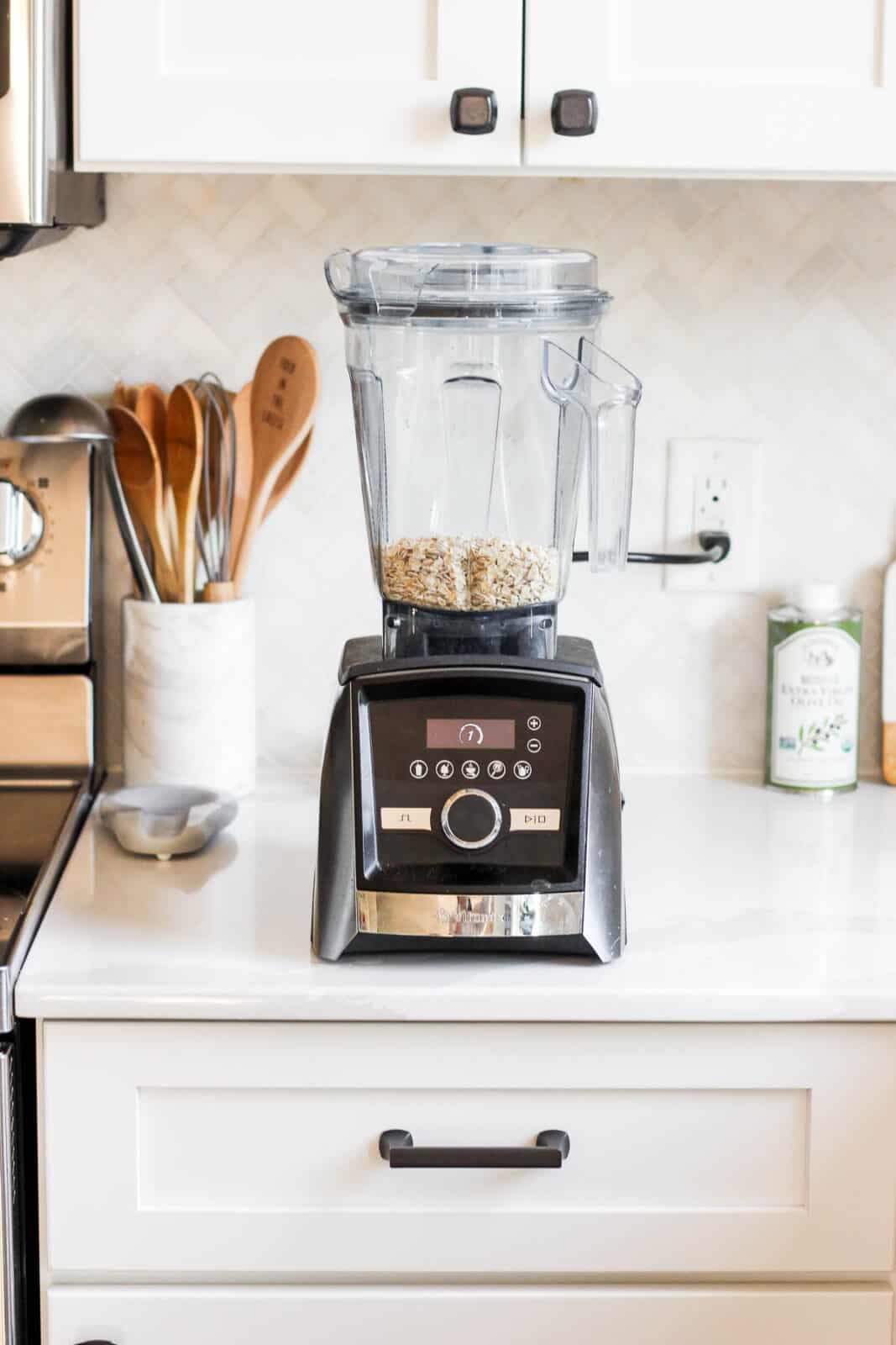 Old-fashioned oats in a blender on the counter.