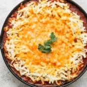 Shepards Pie in a cast iron skillet with cheesy hashbrown topping.