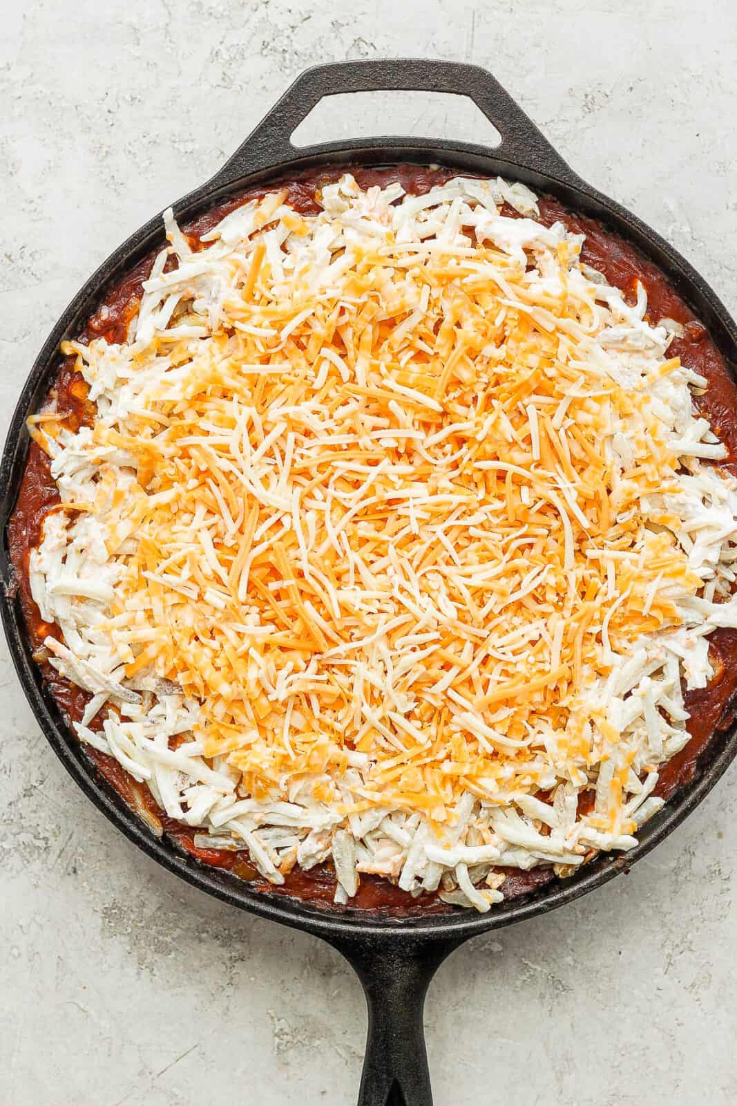 The filling with the cheese and hash brown mixture spread on top.
