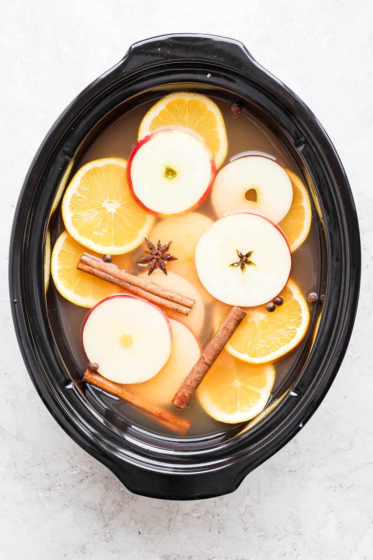 Spiked apple cider in a slow cooker.