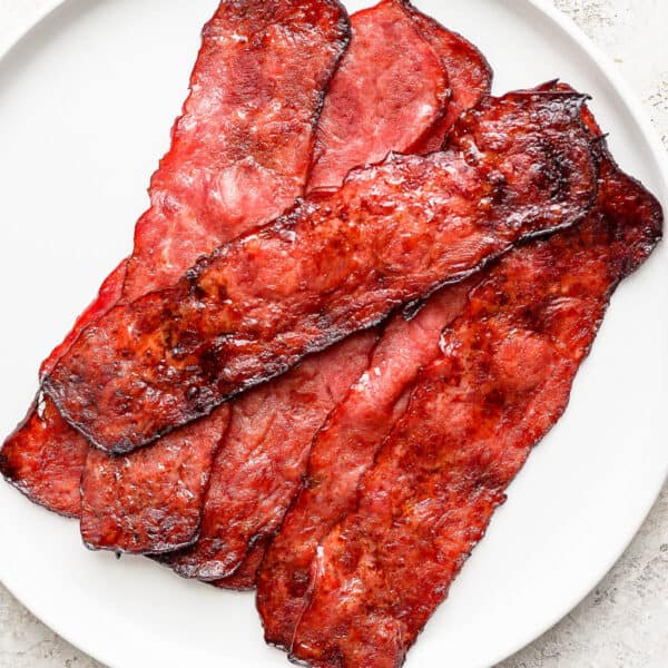 A plate of turkey bacon cooked in the oven.