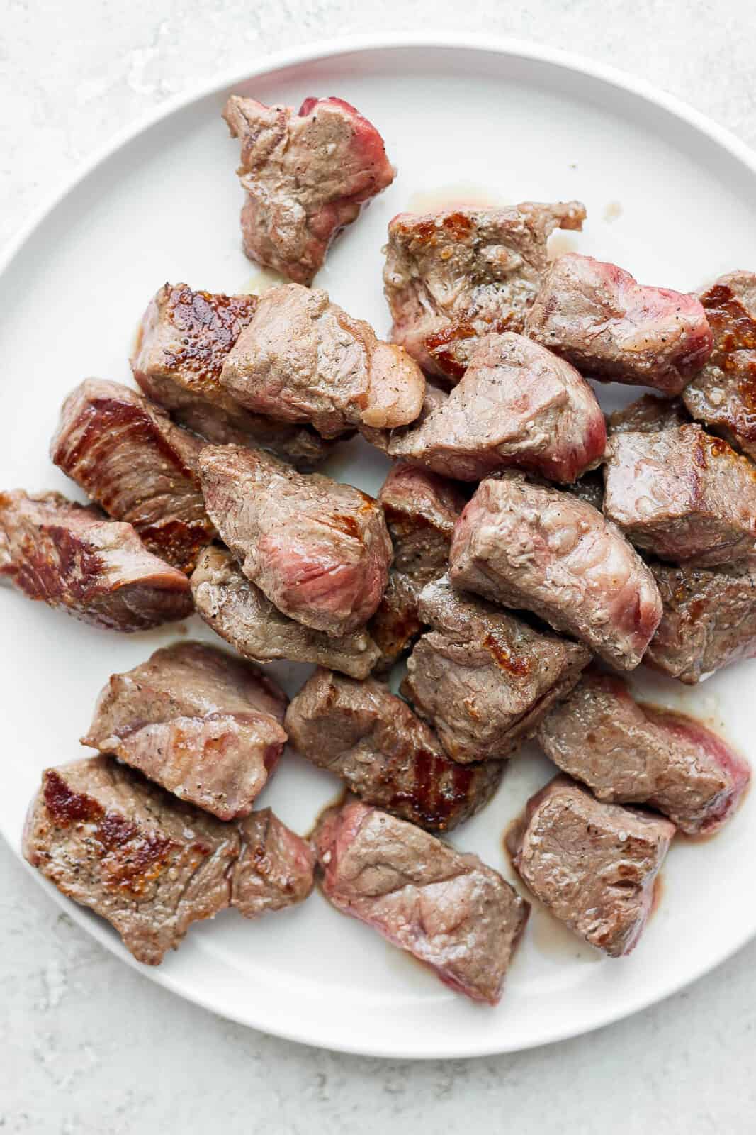 Plate of seared steak bites.