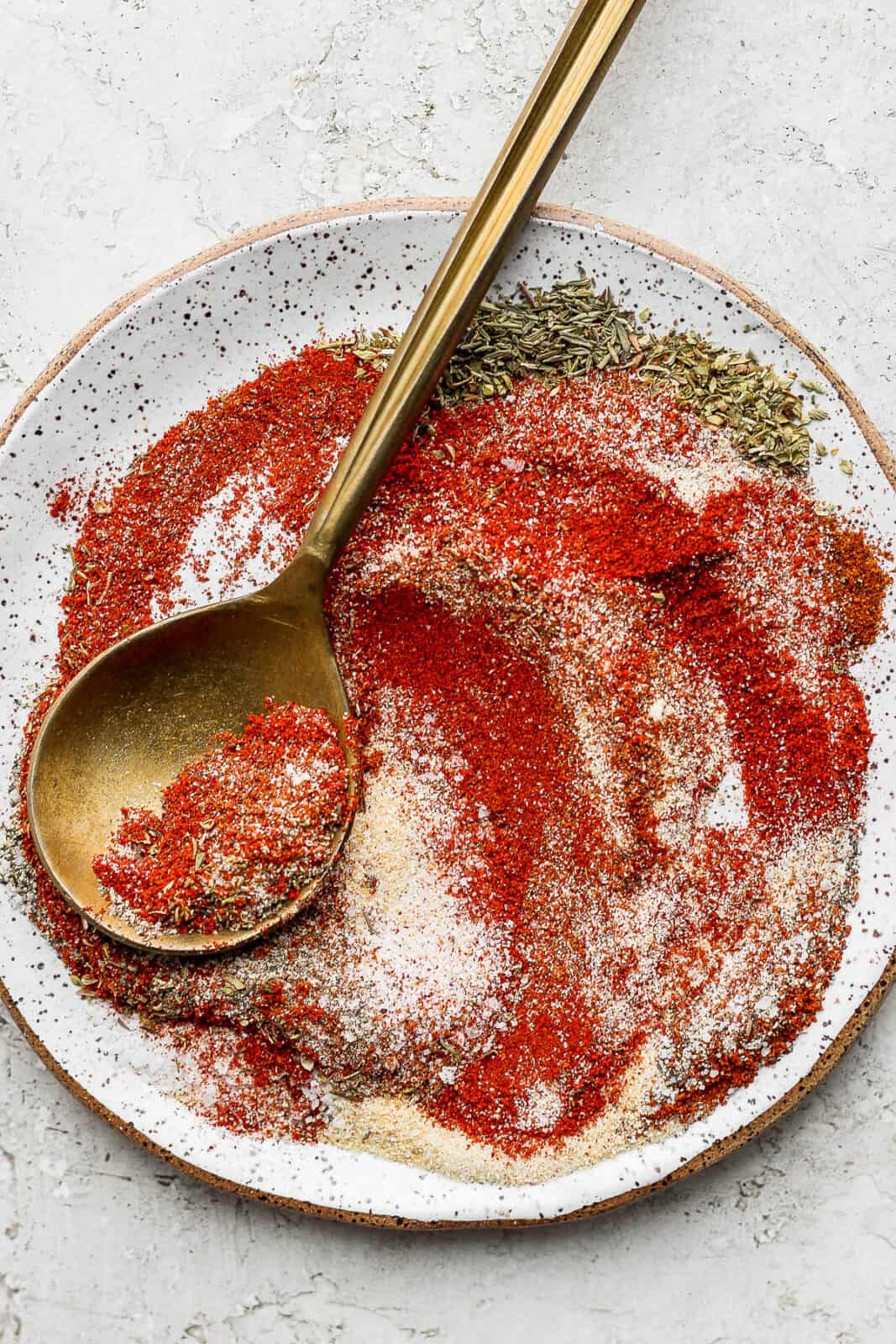 Blackened seasoning mixed on a plate with a spoon.