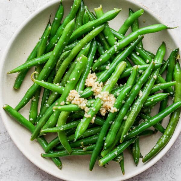 Shallow bowl filled with garlic green beans.