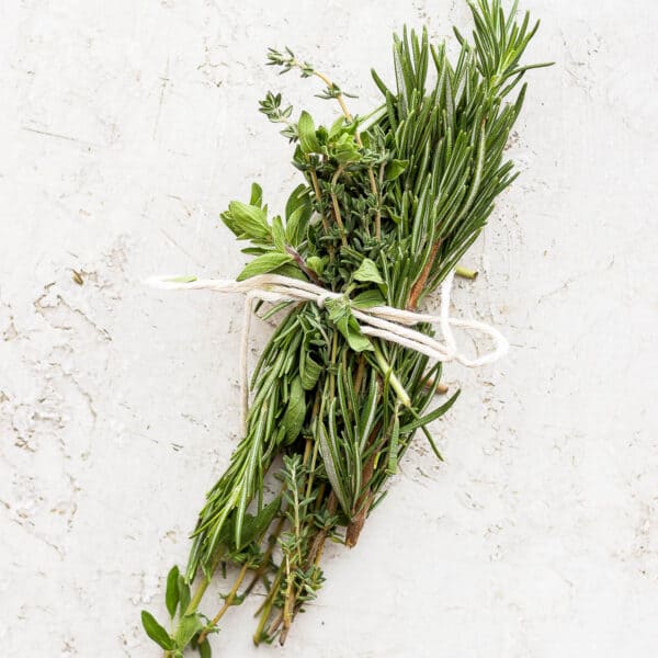 An herb bundle wrapped in cooking twine.